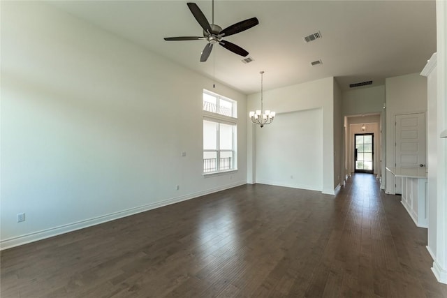 152 Limestone Dr, Georgetown, TX 78628 - spare room featuring plenty of natural light, ceiling fan, a chandelier, dark wood-style flooring, and a high ceiling
