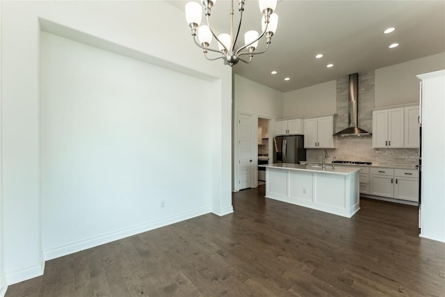 152 Limestone Dr, Georgetown, TX 78628 - kitchen with wall chimney exhaust hood, stainless steel refrigerator with ice dispenser, recessed lighting, white cabinetry, and a chandelier