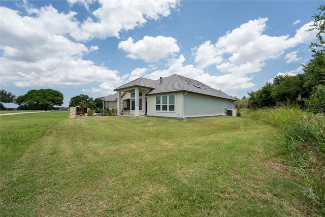 152 Limestone Dr, Georgetown, TX 78628 - view of side of property featuring a yard and a tiled roof