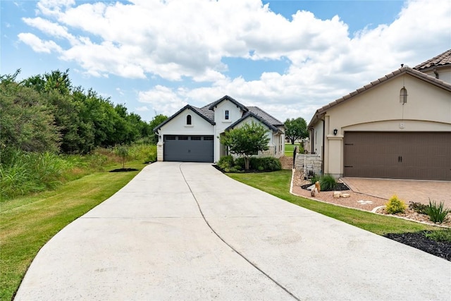 152 Limestone Dr, Georgetown, TX 78628 - view of front of property featuring a front lawn, stucco siding, concrete driveway, and an attached garage