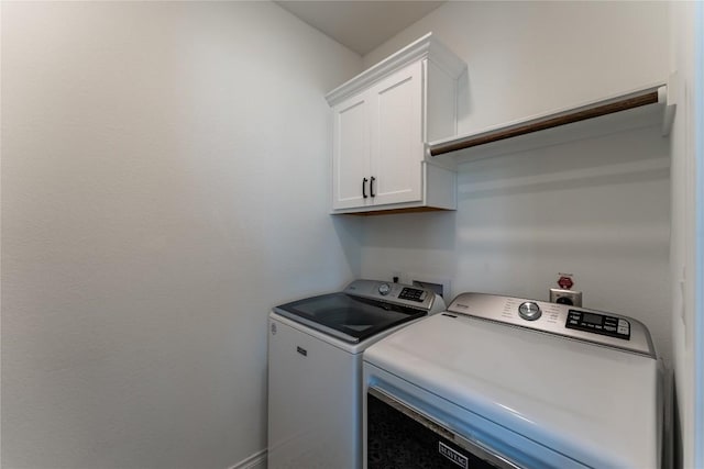152 Limestone Dr, Georgetown, TX 78628 - laundry room featuring washer and clothes dryer and cabinet space