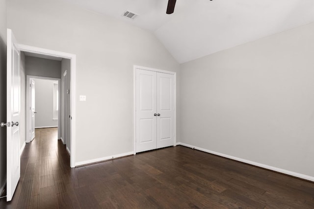 103 County Road 180 Unit 35, Leander, TX 78641 - unfurnished bedroom with dark wood-style floors, lofted ceiling, a closet, and a ceiling fan