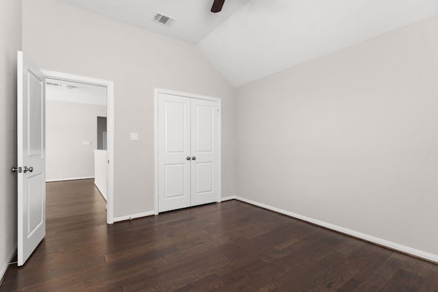 103 County Road 180 Unit 35, Leander, TX 78641 - unfurnished bedroom with dark wood-type flooring, vaulted ceiling, a closet, and a ceiling fan