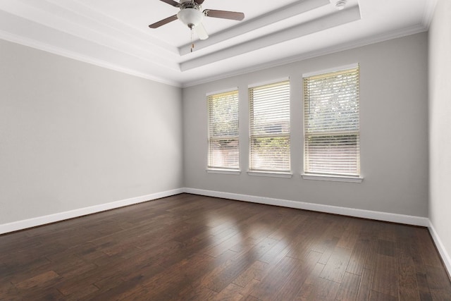 103 County Road 180 Unit 35, Leander, TX 78641 - empty room featuring a tray ceiling, healthy amount of natural light, ornamental molding, dark wood finished floors, and a ceiling fan