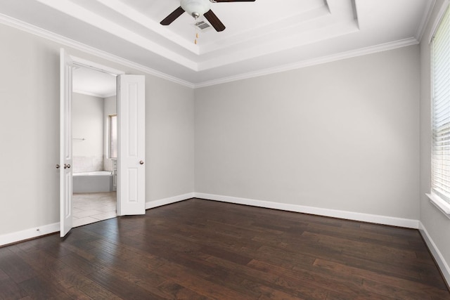 103 County Road 180 Unit 35, Leander, TX 78641 - spare room featuring a tray ceiling, ceiling fan, wood-type flooring, and ornamental molding