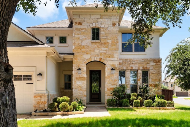 103 County Road 180 Unit 35, Leander, TX 78641 - french provincial home with stone siding, an attached garage, stucco siding, and roof with shingles
