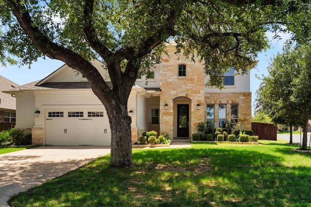103 County Road 180 Unit 35, Leander, TX 78641 - view of front of home with stone siding, concrete driveway, and a garage