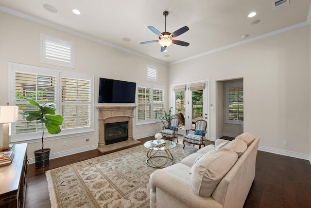 223 Delfino Cir, Austin, TX 78734 - living area with ceiling fan, dark wood-style flooring, a high end fireplace, ornamental molding, and recessed lighting