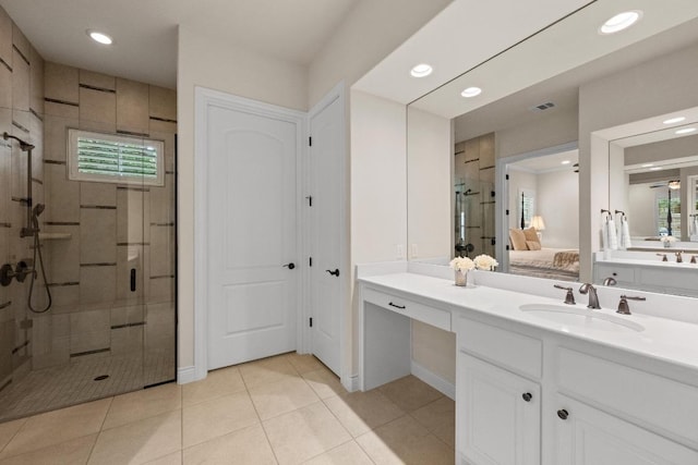 223 Delfino Cir, Austin, TX 78734 - ensuite bathroom with a stall shower, vanity, recessed lighting, and tile patterned floors