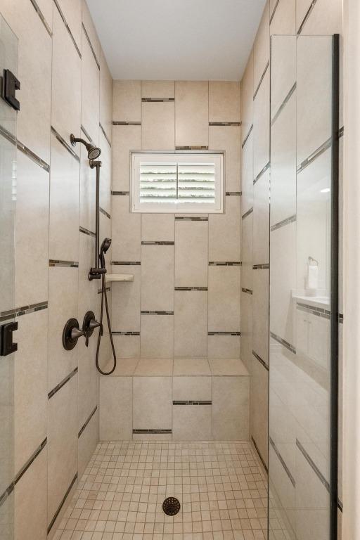 223 Delfino Cir, Austin, TX 78734 - bathroom featuring a stall shower