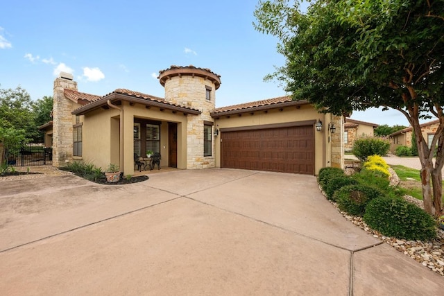 223 Delfino Cir, Austin, TX 78734 - mediterranean / spanish home with stucco siding, driveway, a garage, and stone siding