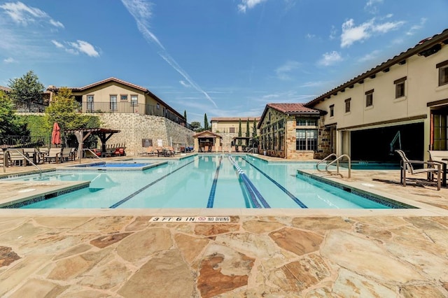 223 Delfino Cir, Austin, TX 78734 - community pool featuring a community hot tub and a patio