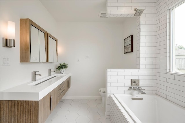 16302 Bates Cv, Pflugerville, TX 78660 - bathroom with plenty of natural light, a garden tub, tile patterned floors, and vanity