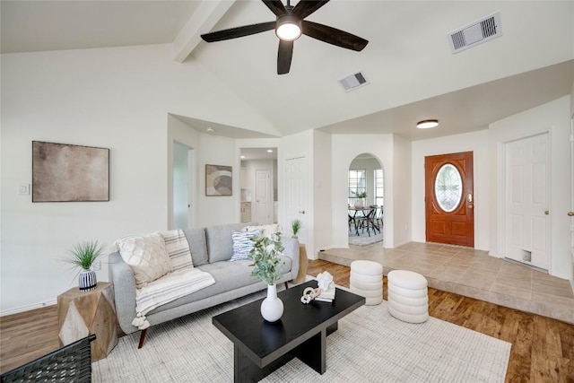 16302 Bates Cv, Pflugerville, TX 78660 - living area with arched walkways, a ceiling fan, and wood finished floors