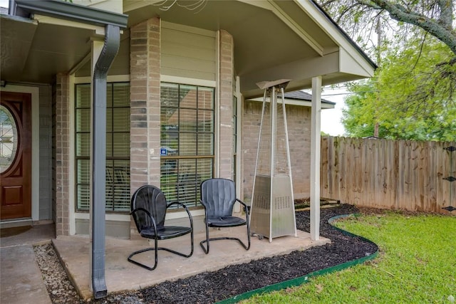 16302 Bates Cv, Pflugerville, TX 78660 - view of exterior entry featuring a patio and brick siding