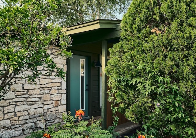 6806 Syracuse Cv, Austin, TX 78723 - doorway to property featuring stone siding