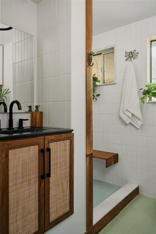 6806 Syracuse Cv, Austin, TX 78723 - bathroom with tile walls and a sink