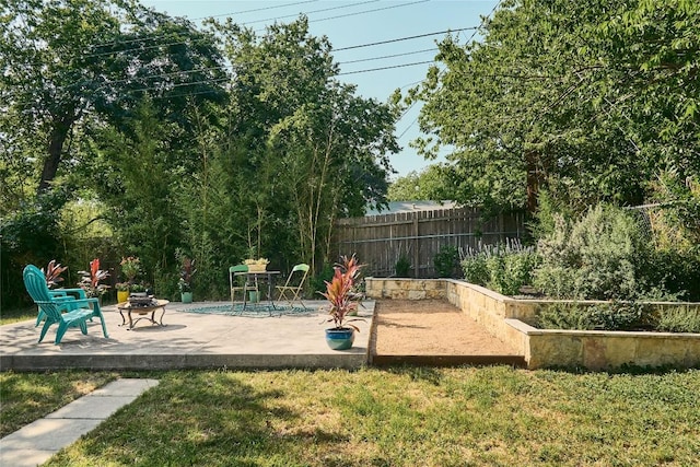 6806 Syracuse Cv, Austin, TX 78723 - view of playground featuring a patio, a fire pit, and a garden