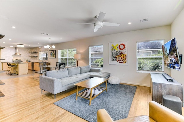 3004 Breeze Ter, Austin, TX 78722 - living room featuring light wood-style floors, a ceiling fan, and recessed lighting