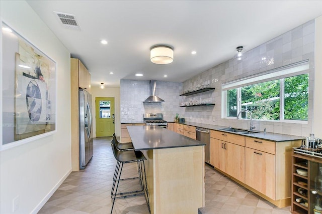3004 Breeze Ter, Austin, TX 78722 - kitchen featuring light brown cabinetry, appliances with stainless steel finishes, wall chimney range hood, open shelves, and recessed lighting