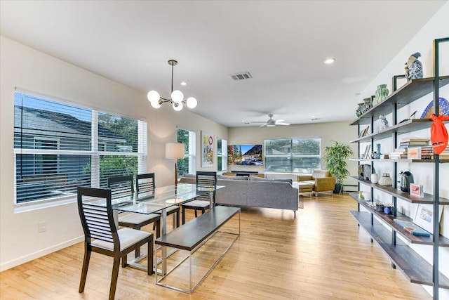 3004 Breeze Ter, Austin, TX 78722 - dining room with light wood-type flooring, a ceiling fan, a chandelier, and recessed lighting