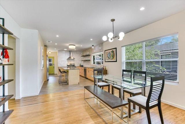 3004 Breeze Ter, Austin, TX 78722 - dining area with a chandelier, recessed lighting, and light wood-type flooring