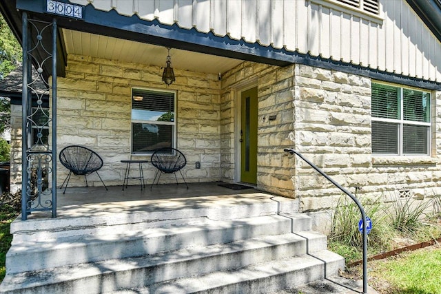 3004 Breeze Ter, Austin, TX 78722 - property entrance with stone siding and board and batten siding