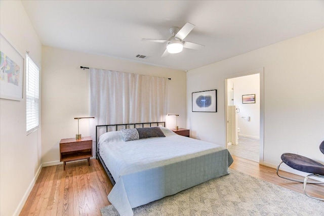 3004 Breeze Ter, Austin, TX 78722 - bedroom with wood finished floors, ceiling fan, and ensuite bath