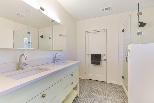 3004 Breeze Ter, Austin, TX 78722 - bathroom featuring a stall shower and double vanity
