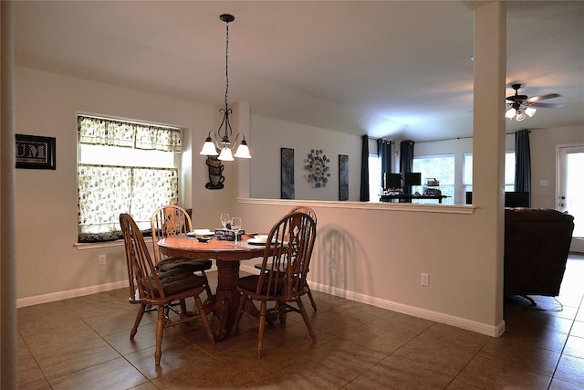 201 Hale Irwin Loop, Round Rock, TX 78664 - tiled dining area with a chandelier and ceiling fan