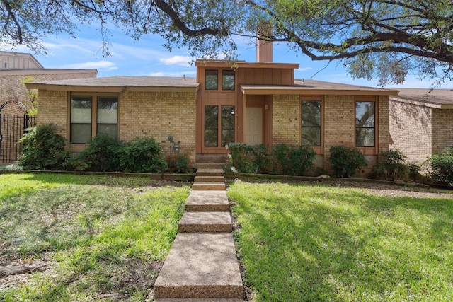 7907 Tealwood Trl, Austin, TX 78731 - mid-century home featuring brick siding and a chimney