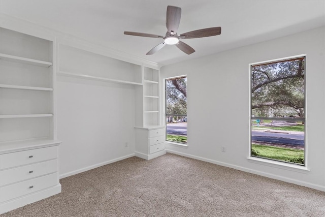 7907 Tealwood Trl, Austin, TX 78731 - carpeted empty room featuring a ceiling fan and built in features