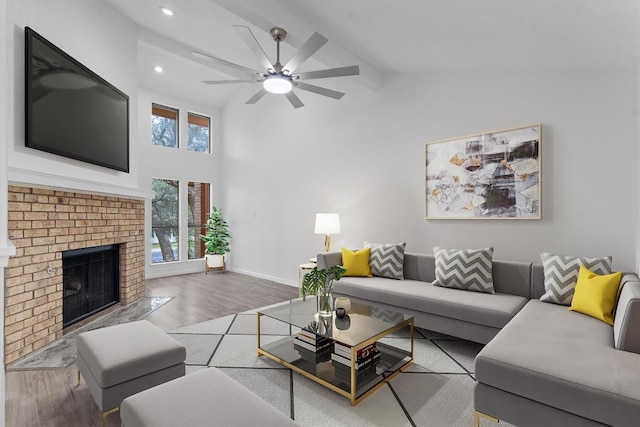 7907 Tealwood Trl, Austin, TX 78731 - living area with wood finished floors, ceiling fan, a fireplace, recessed lighting, and high vaulted ceiling