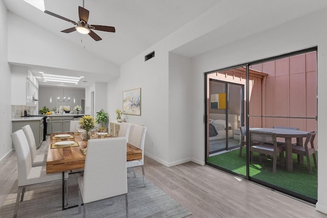 7907 Tealwood Trl, Austin, TX 78731 - dining room featuring light wood finished floors, vaulted ceiling, and ceiling fan
