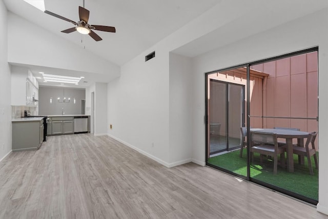 7907 Tealwood Trl, Austin, TX 78731 - unfurnished living room featuring light wood-type flooring, lofted ceiling, and ceiling fan