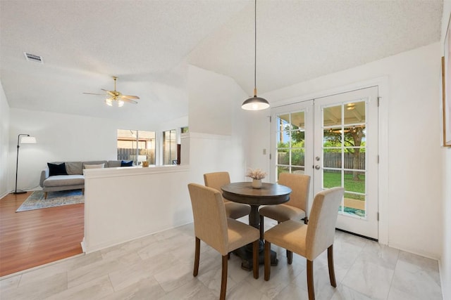 7806 Vail Valley Dr, Austin, TX 78749 - dining space with healthy amount of natural light, french doors, lofted ceiling, and ceiling fan