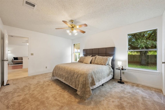 7806 Vail Valley Dr, Austin, TX 78749 - carpeted bedroom featuring a textured ceiling and a ceiling fan
