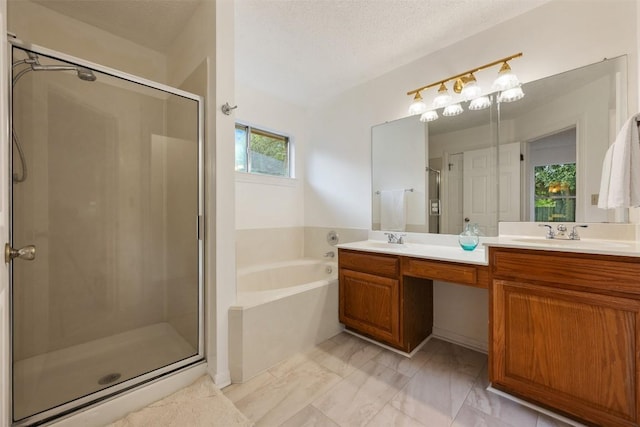 7806 Vail Valley Dr, Austin, TX 78749 - full bathroom featuring a garden tub, a shower stall, double vanity, and marble look tiles