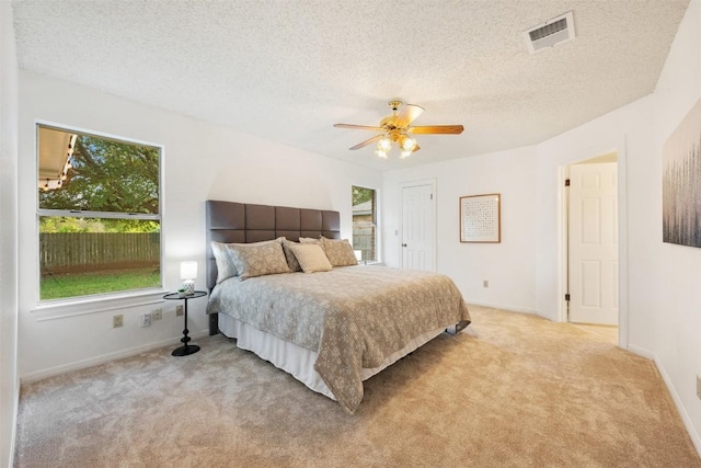 7806 Vail Valley Dr, Austin, TX 78749 - bedroom featuring carpet, ceiling fan, and a textured ceiling