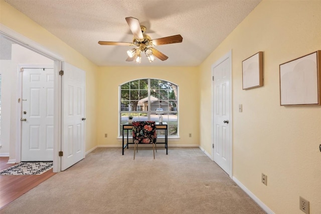 7806 Vail Valley Dr, Austin, TX 78749 - entrance foyer featuring ceiling fan, light colored carpet, and a textured ceiling