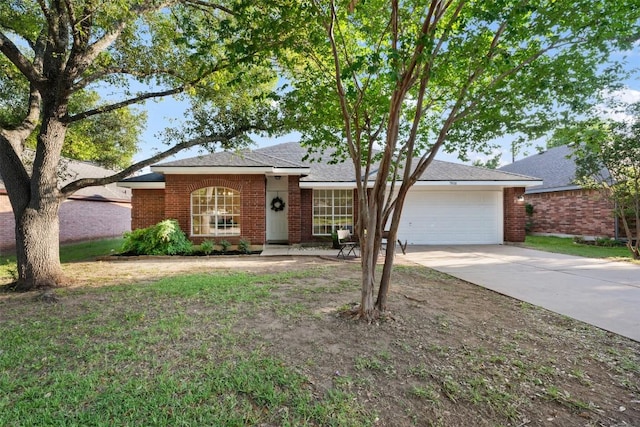 7806 Vail Valley Dr, Austin, TX 78749 - ranch-style house featuring a garage, concrete driveway, and brick siding