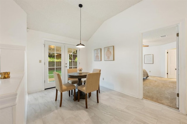 7806 Vail Valley Dr, Austin, TX 78749 - dining room featuring french doors, vaulted ceiling, and light carpet