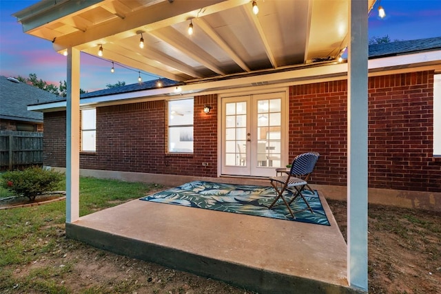 7806 Vail Valley Dr, Austin, TX 78749 - patio terrace at dusk with french doors and a patio area