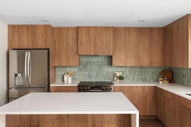 10006 Mandeville Cir, Austin, TX 78750 - kitchen with stainless steel fridge, modern cabinets, light countertops, and brown cabinetry