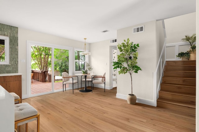 10006 Mandeville Cir, Austin, TX 78750 - sitting room with light wood finished floors and stairway