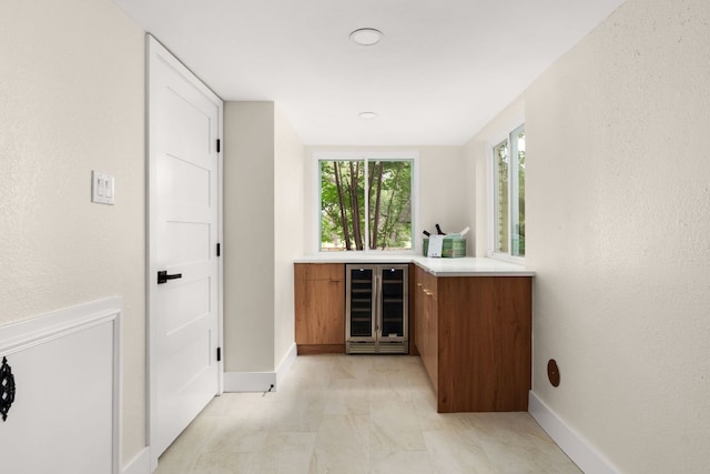 10006 Mandeville Cir, Austin, TX 78750 - indoor dry bar with wine cooler and healthy amount of natural light