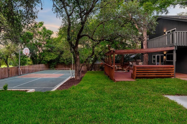 10006 Mandeville Cir, Austin, TX 78750 - view of yard with basketball hoop and an outdoor hangout area