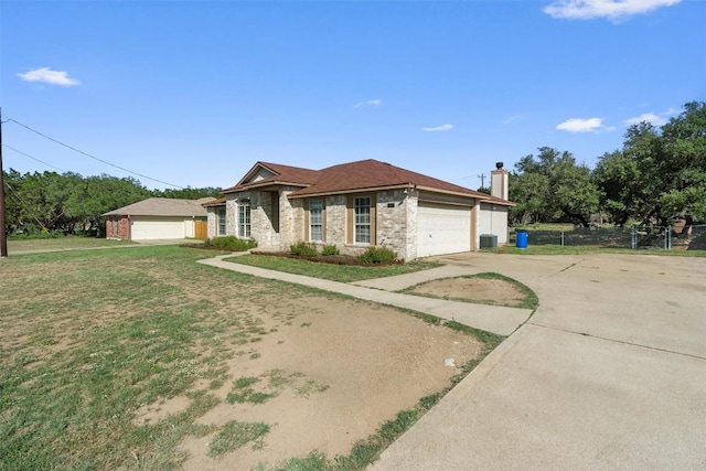 6005 La Mesa St, Leander, TX 78645 - ranch-style home featuring a chimney and concrete driveway