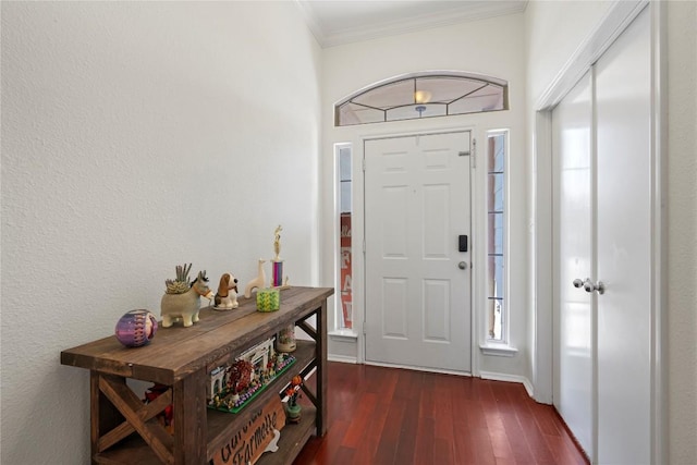 6005 La Mesa St, Leander, TX 78645 - foyer entrance with crown molding and dark wood finished floors