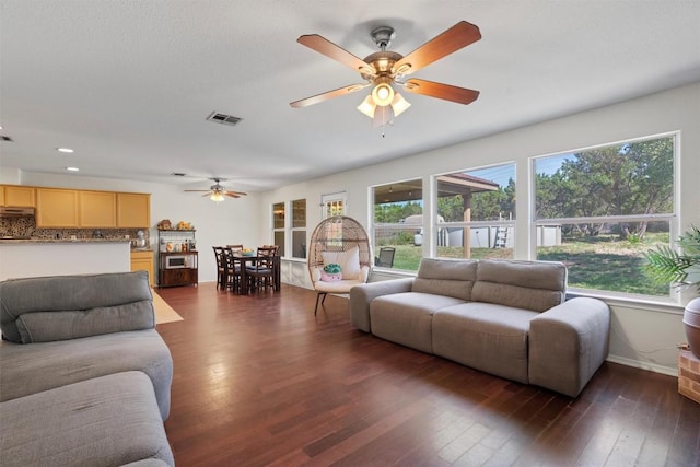 6005 La Mesa St, Leander, TX 78645 - living room featuring a ceiling fan, dark wood-type flooring, and recessed lighting